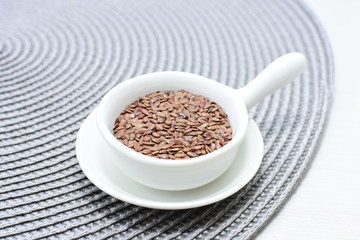  natural flaxseed seeds displayed in containers