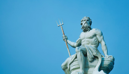 Fototapeta Ancient stone statue of mighty god of the sea and oceans Neptune (Poseidon) with trident. obraz