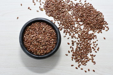  natural flaxseed seeds displayed in containers