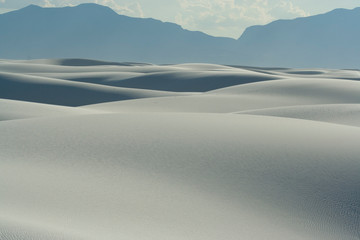 Wide view of undulating white dune field at White Sands National Park