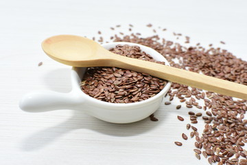  natural flaxseed seeds displayed in containers