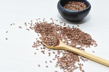  natural flaxseed seeds displayed in containers