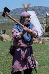Viking warrior in his camp, with an ax in his hand
