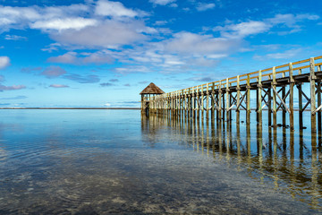 Dock and hut with clearwater lagoon in Fiji