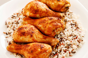 Indian cuisine: roasted chicken with rice and vegetables.