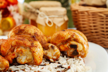 Indian cuisine: roasted chicken with rice and vegetables.