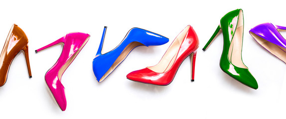 female shiny colored stilettos on a white background