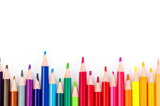 macro multicolored pencils on a white background