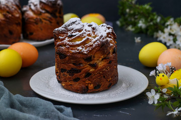 Easter cake Cruffin and colorful eggs on a dark background, The concept of the spring orthodox church holiday, Horizontal orientation