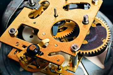 Fototapeta na wymiar Clock mechanism gears and cogs. Metal gears of old clock mechanism. Clockwork background