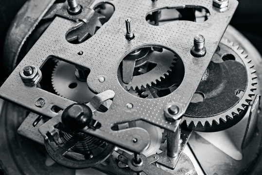 Clock mechanism gears and cogs. Metal gears of old clock mechanism. Clockwork background