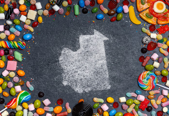 Sugar in the shape of Mauritania surrounded by a variety of sweets. (series)