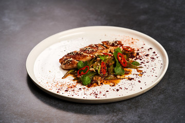 Spicy chicken breast with minted green beans, close-up