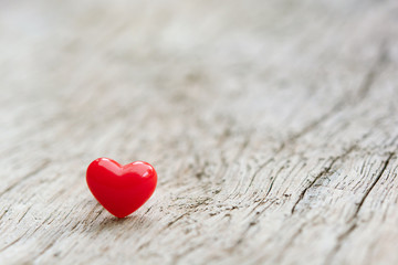 Valentines Day concept -  Red hearts on plank wooden background with copy space.