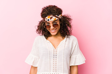 Young african american hipster woman isolated on pink background happy, smiling and cheerful.