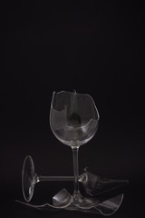 broken water glass on the on the back background The concept of accidents in the kitchen is dangerous for the body and young children inside the house.