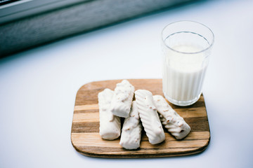 glass of milk and cookies on a plate