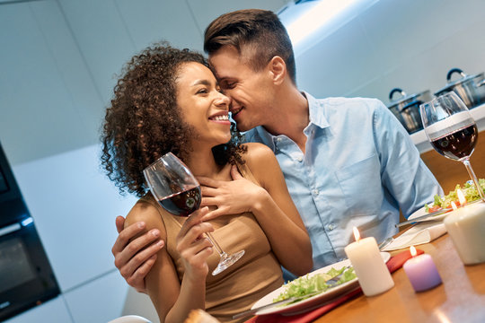 Young Adult Mixed Race Couple Laughing And Having Romantic Dating At Home