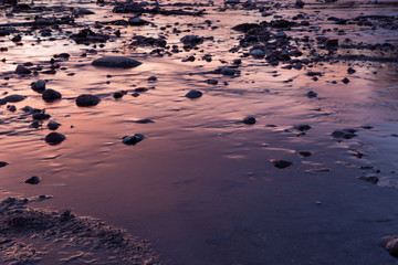 sunset over water and rocks 