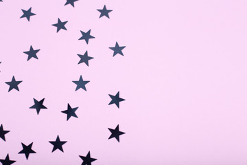 Holiday background with little black stars