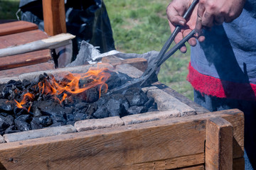 Close-up of a Viking forge, when they are manufacturing a piece