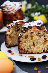 Easter cake Cruffin and colorful eggs on a dark background, The concept of the spring orthodox church holiday, Vertical orientation
