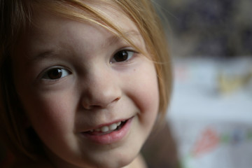 Smiling, excited little girl playing outside