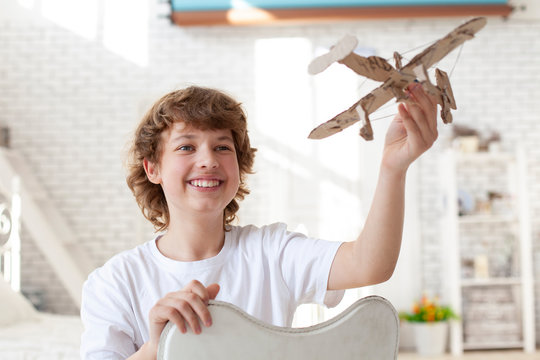 teenager with model airlplane