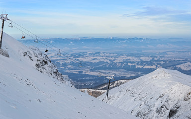 Chair lifts at the top of Kasprowy Wierch in Zakopane in winter. Zakopane is a town in Poland in...