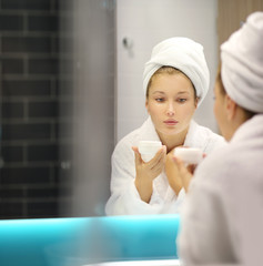 Magic anti-aging cream.Applying the cream	