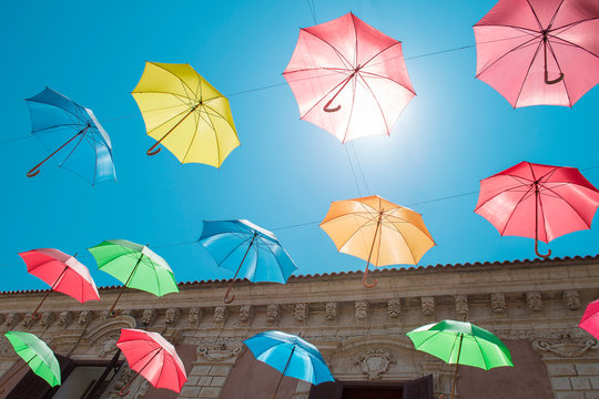  Licata street decorated with umbrella. Sicily, Italy