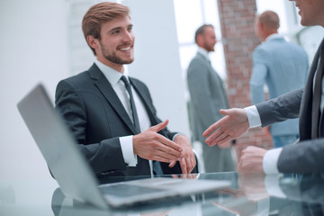 close up. business people holding out their hands for a handshake