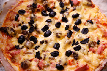 Overhead shot of friends at a table sharing take-away pizzas