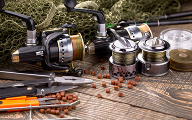 Spinning and fishing rods on an old background