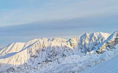 Sunny weather in Kasprowy Wierch in Zakopane in Tatra Mounts in winter. Zakopane is a town in Poland in Tatra Mountains. Kasprowy Wierch is a mount in Zakopane and the most popular ski area in Poland