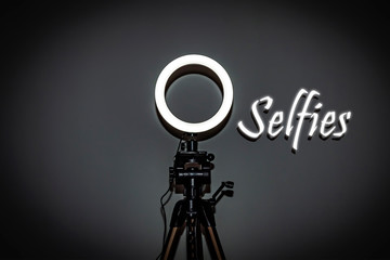 Selfies. LED ring lamp with adjustable brightness for a studio camera, photo phone, video lamp with tripods