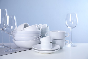 Set of clean tableware on light table