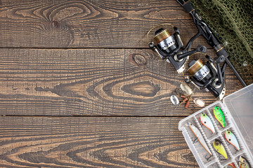 fishing tackle on a wooden table.