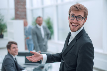 close up. smiling friendly businessman standing in the office