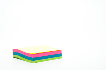 Notebook with colorful leaflets. Pile of stickers. On white background