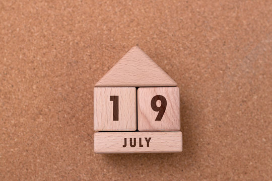 July 19 written with wooden blocks