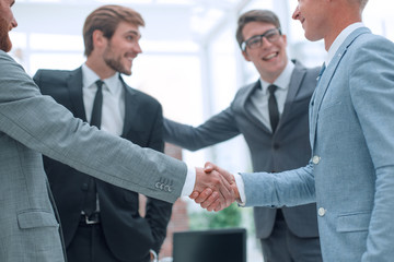 welcome handshake of business people in the office