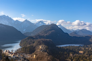 Panorama view of the Bavarian Alps and Lake with the famous Hohenschwangau Castle and Alpsee lake, Schwansee lake in winter