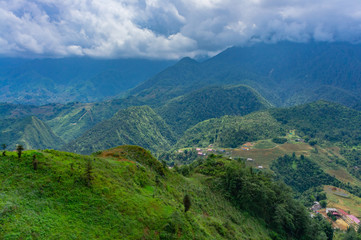 cenery of Cat Cat village, popular tourist trekking destination. Rice field terraces.  Mountain view in the clouds. Sapa, Lao Cai Province, north-west Vietnam.