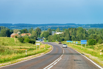 Fototapeta na wymiar Scenery with car on the road in Poland