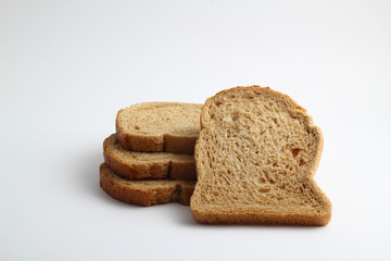 Isolate of white loaf of bread with sliced ​​pieces on a white background