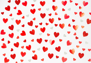 Valentine's day concept. Background from different bright red hearts on a white background