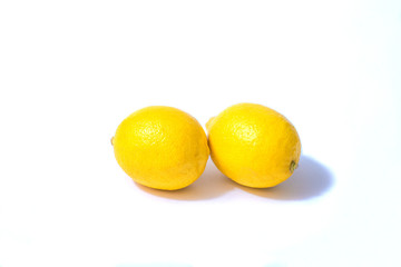 two lemons isolated on white background