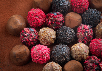 Truffle Chocolates. Assorted Chocolate praline Candies. Chocolate Set Sweets. Round Candy Design Background. Heart Shaped Chocolate. Top view, flatlay backdrop