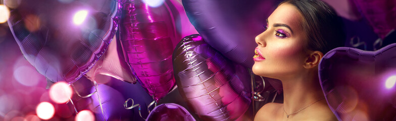 Beauty fashion model girl creative art makeup, over purple, pink and violet air balloons...
